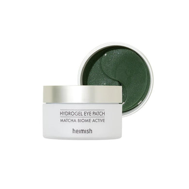 HEIMISH Matcha Biome Hydrogel Eye Patch is a refreshing and hydrating eye treatment designed to soothe and brighten the delicate under-eye area. Infused with Matcha Extract, Niacinamide, and Lactobacillus Ferment, these patches provide deep hydration, reduce puffiness, and improve skin elasticity. Enriched with botanical extracts like Chamomile, Rosemary, and Licorice Root, they calm and nourish tired eyes while Allantoin soothes irritation. With a cooling hydrogel texture, these patches adhere comfortably,