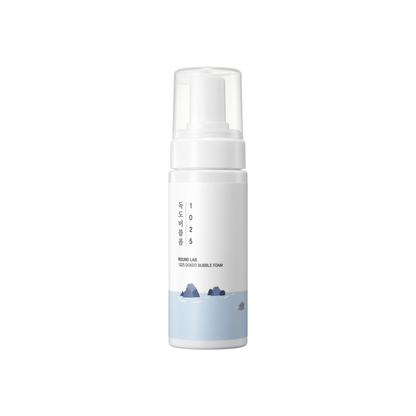 ROUND LAB 1025 Dokdo Bubble Foam is a gentle foaming cleanser designed to remove impurities, excess oil, and daily buildup without leaving the skin feeling dry. Formulated with Sea Water, Salicylic Acid, Panthenol, Allantoin, Centella Asiatica Leaf Extract, Green Tea Extract, Willow Bark Extract, and Hyaluronic Acid, it helps cleanse pores, soothe the skin, and maintain hydration. The rich, dense foam leaves skin feeling clean, soft, and refreshed, making it best suited for normal, combination, oily, and bl
